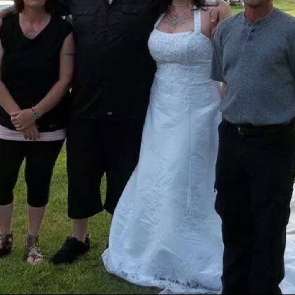 beautiful lacy pearl wedding dress